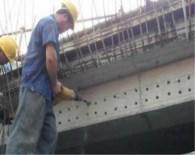 What kind of anchoring adhesive is used for bridge reinforcement?